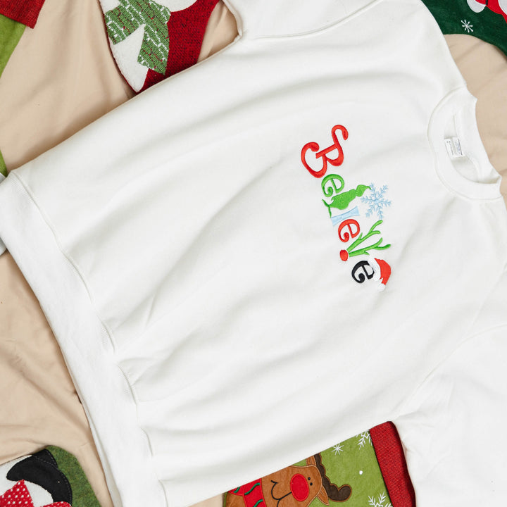 believe Glitch embroidered Christmas hoodie
