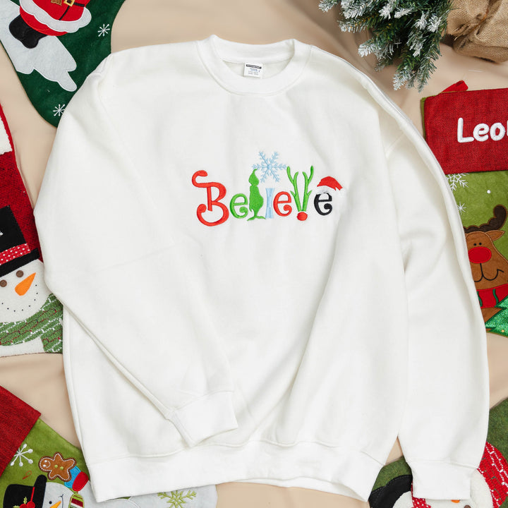 believe Glitch embroidered Christmas hoodie