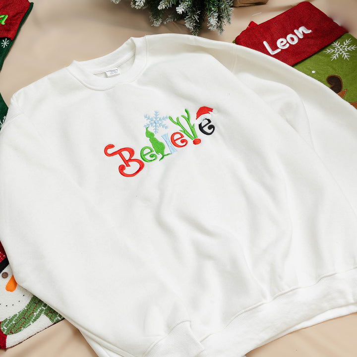 believe Glitch embroidered Christmas hoodie